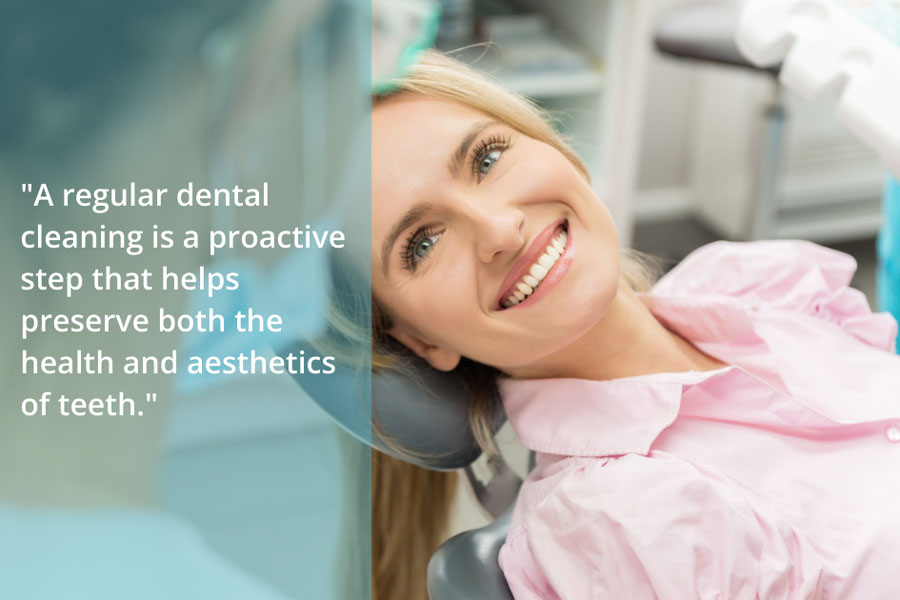 a woman getting dental treatment and smiling