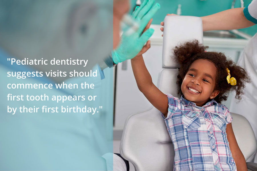 a toddler getting dental treatment and smiling