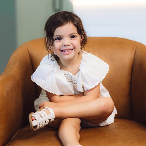 little girl sitting in chair