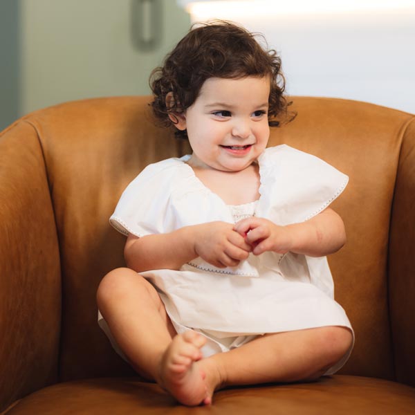 little girl sitting in chair